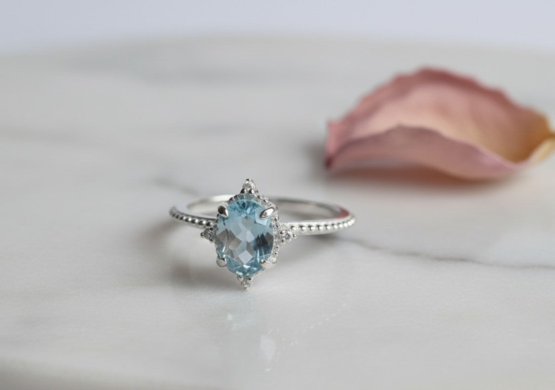 Whispers of the Ocean Ring: Natural Blue Topaz with Dazzling Moissanite Halo