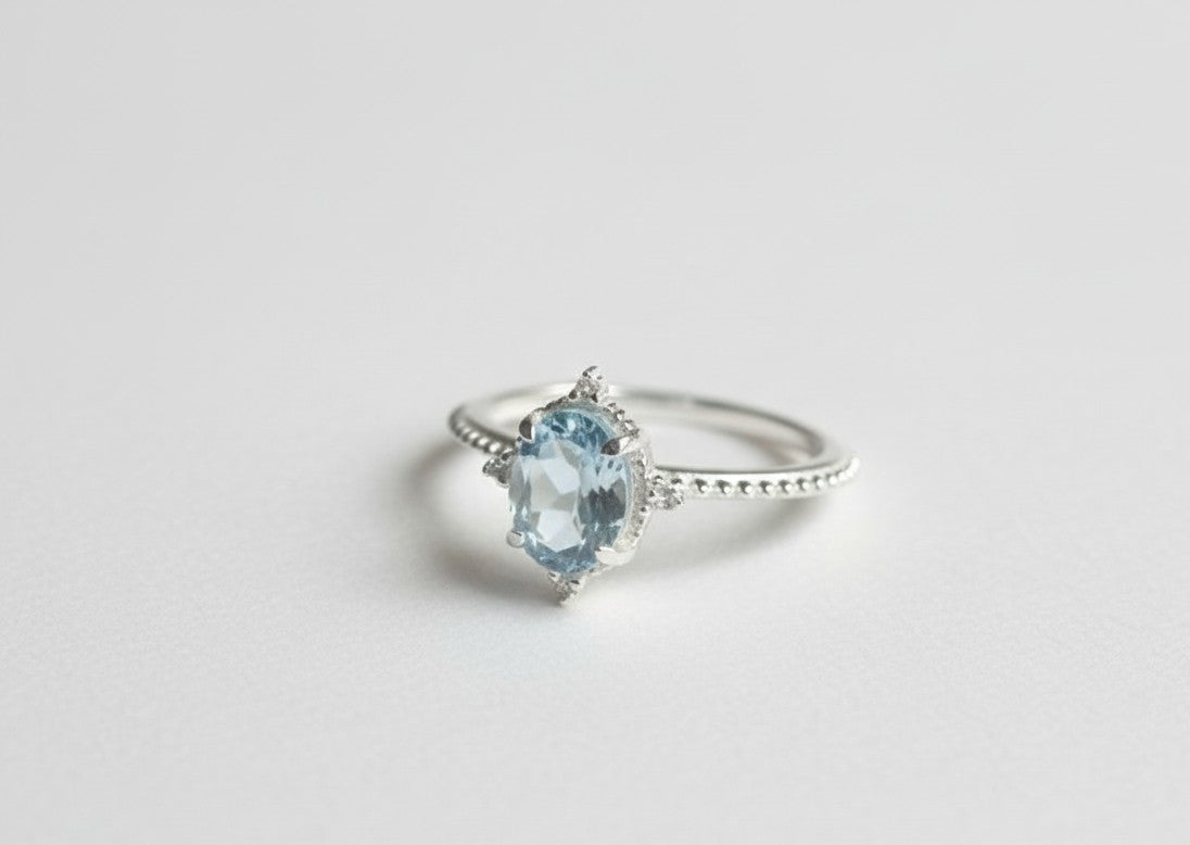 Whispers of the Ocean Ring: Natural Blue Topaz with Dazzling Moissanite Halo