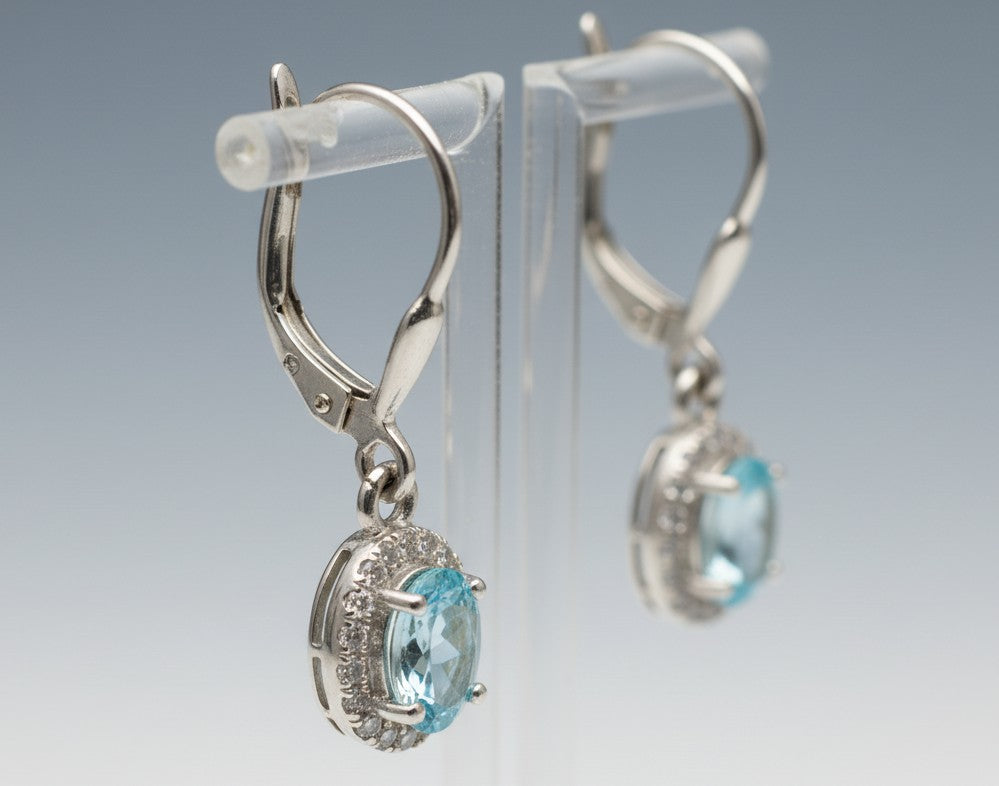 Ocean Serenity Dangles: Natural Blue Topaz Halo Drop Earrings in Sterling Silver