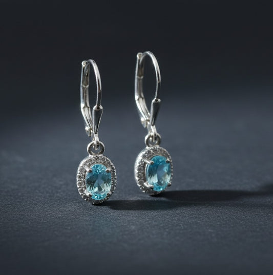 Ocean Serenity Dangles: Natural Blue Topaz Halo Drop Earrings in Sterling Silver