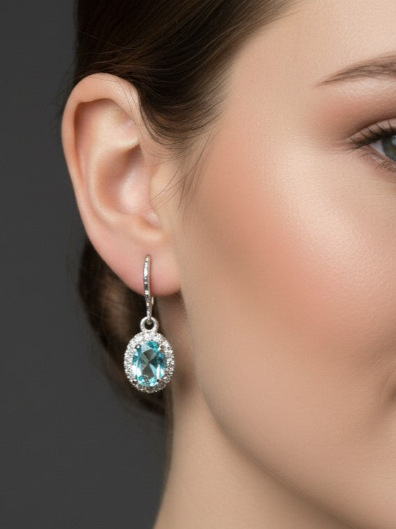 Ocean Serenity Dangles: Natural Blue Topaz Halo Drop Earrings in Sterling Silver