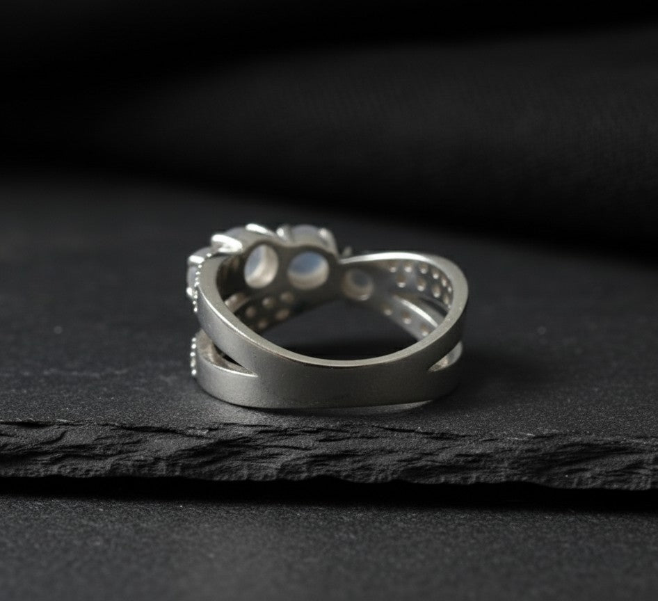 Celestial Cross Ring: Natural Moonstone Trio with Sparkling Moissanite Bypass Band