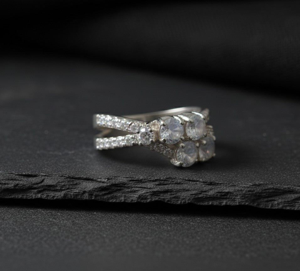 Celestial Cross Ring: Natural Moonstone Trio with Sparkling Moissanite Bypass Band