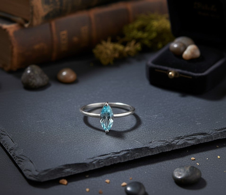 Celestial Point Ring: Natural Marquise Blue Topaz Solitaire in Sterling Silver