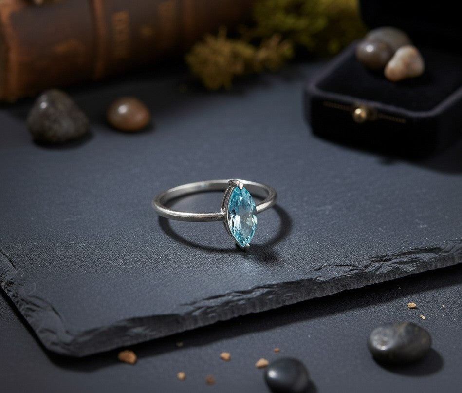 Celestial Point Ring: Natural Marquise Blue Topaz Solitaire in Sterling Silver