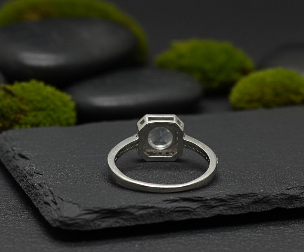 Celestial Halo Ring: Natural Moonstone & Dazzling Moissanite Cluster in Sterling Silver