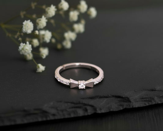 Brilliant Bow Stacker: Natural Moissanite Eternity Band with Central Focus