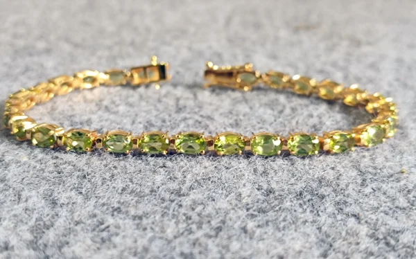Natural Oval cut Peridot Tennis Bracelet In Platinum Overlay Sterling Silver .